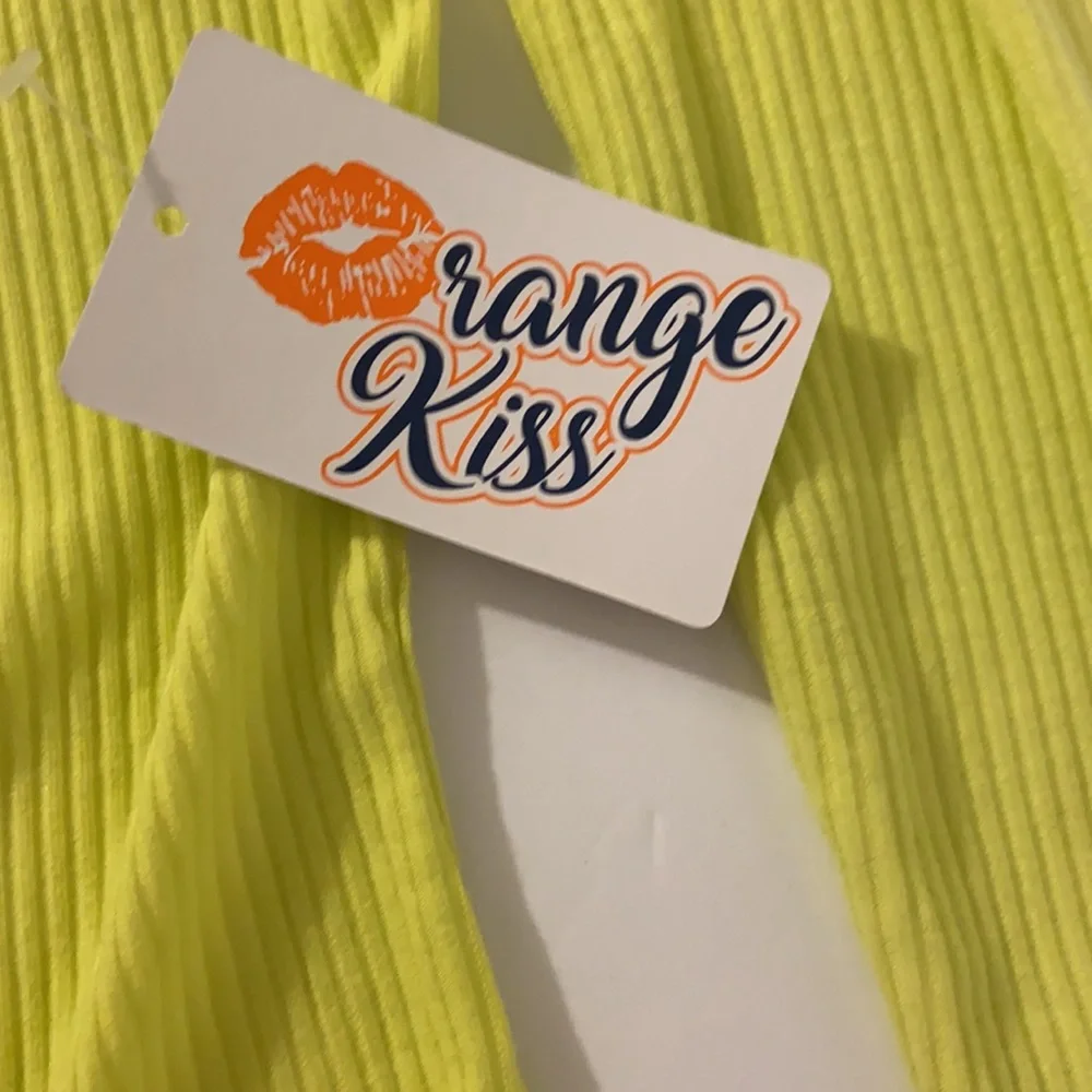 Neon yellow long sleeve sexy body suit. Size small. New with tags